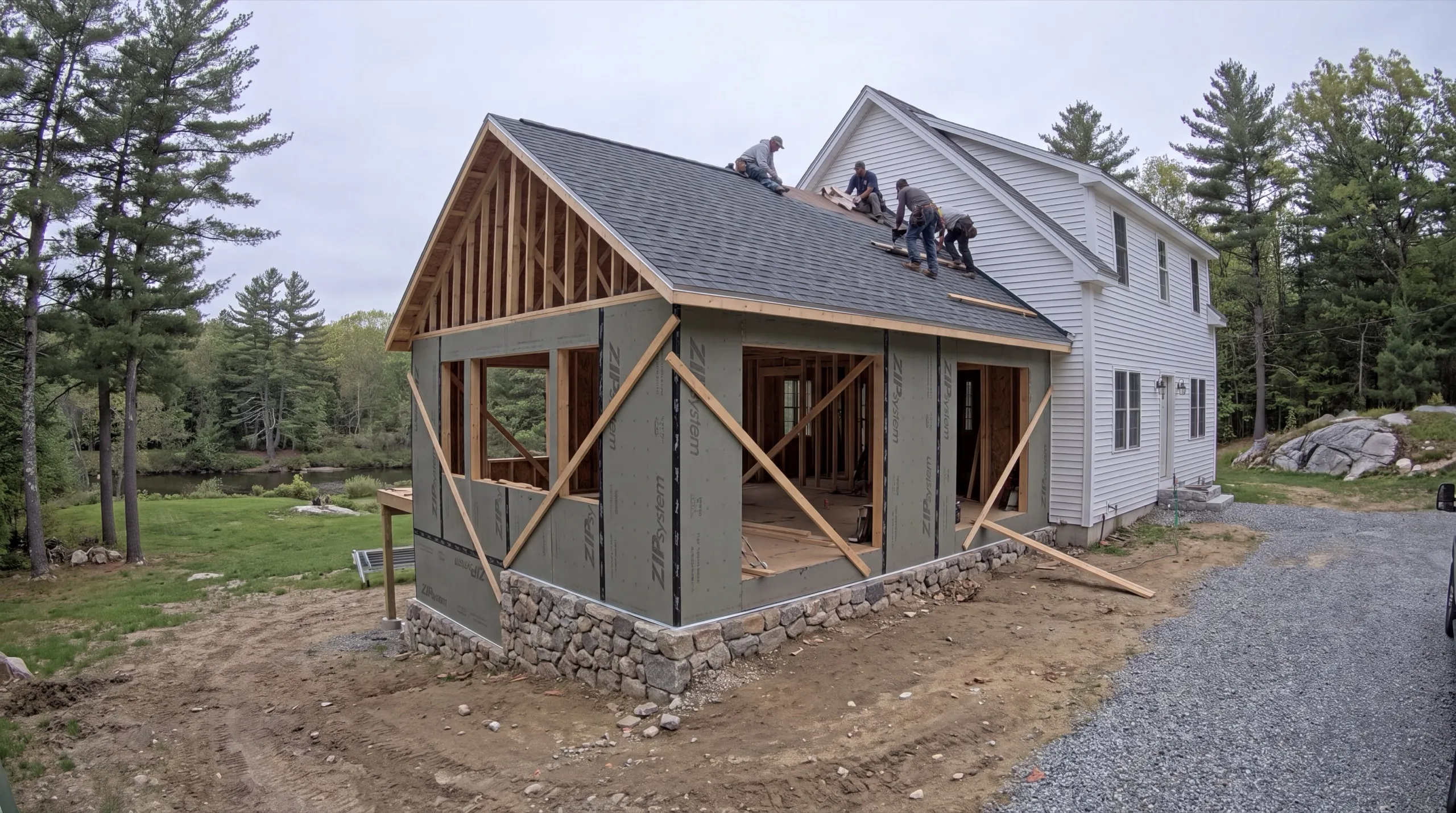 general contractor in Pittston, ME reviewing plans on the Kennebec